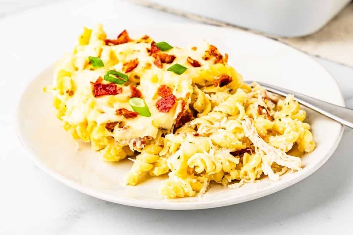 A spring casserole of pasta with cheese and bacon in it.