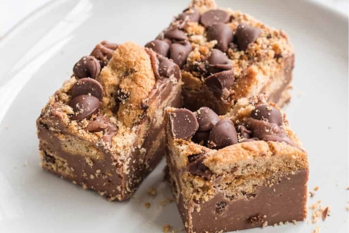 Chocolate chip cookie fudge on a white plate for potluck desserts.