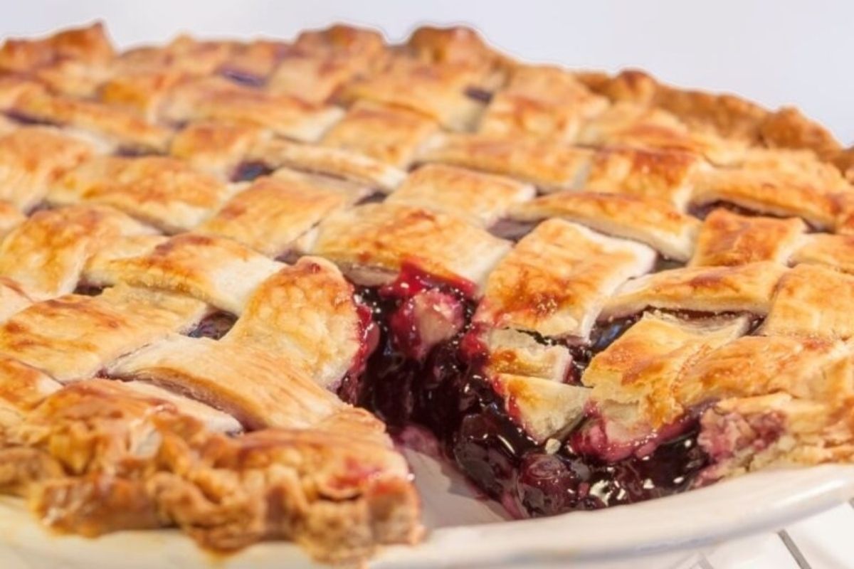 A potluck pie with a slice taken out of it.