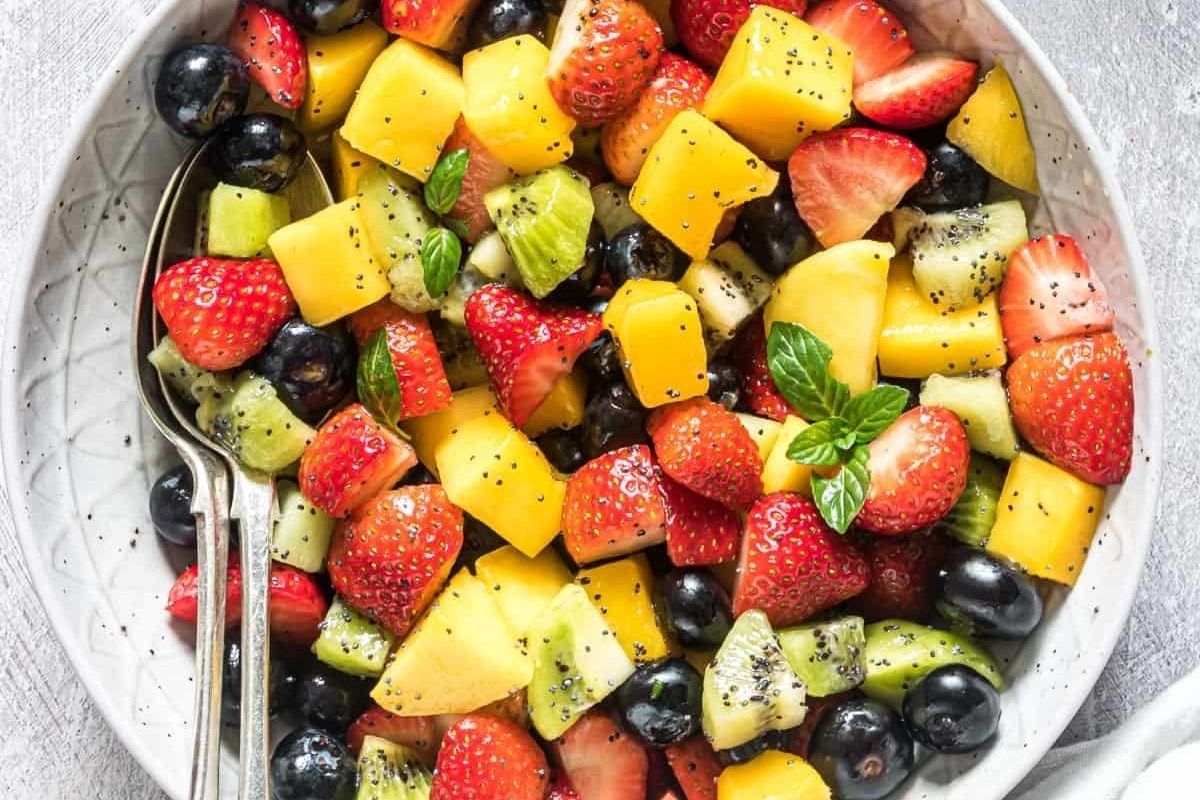 A bowl of fruit salad for potluck desserts.