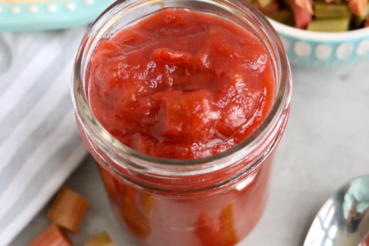 A jar of chunky homemade rhubarb recipes compote.