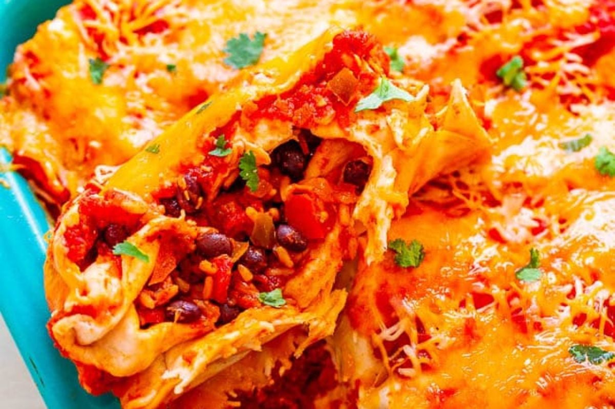 A plate of enchiladas topped with melted cheese and garnished with chopped cilantro, presented alongside suggestions for burrito recipes, with one enchilada partially lifted showing the beans and cheese filling.