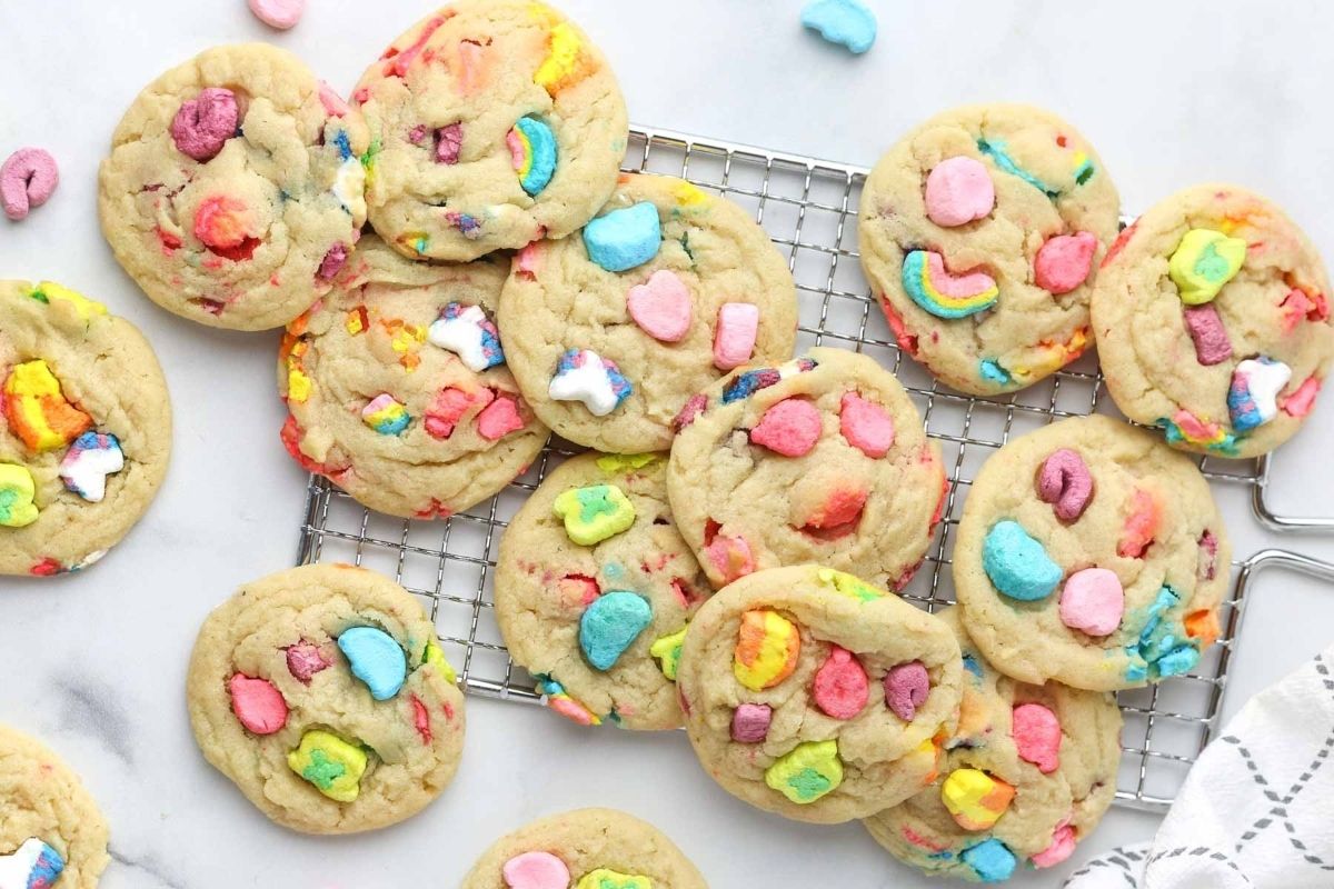 St. Patrick's Day cookies made with recipes using Lucky Charms on a cooling rack.