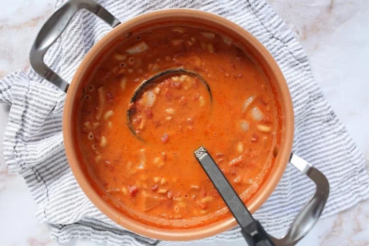 A pot of soup with a ladle, perfect for exploring new soup recipes.