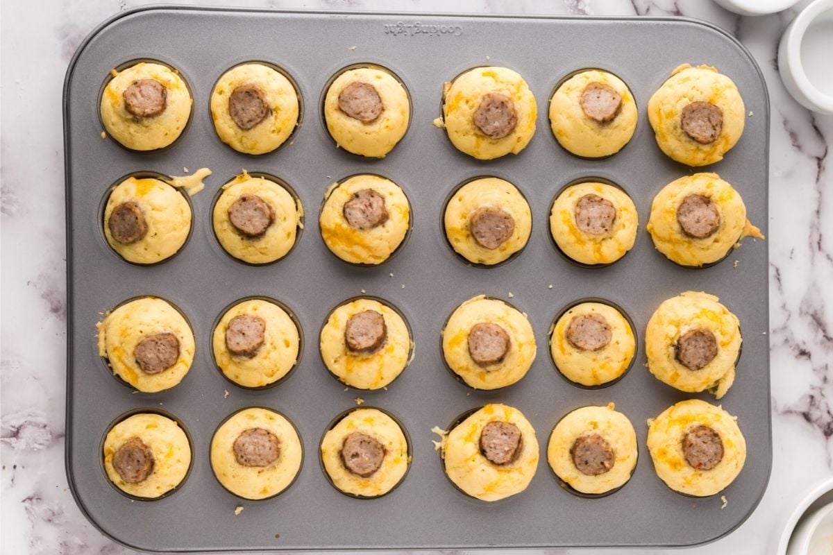 Freshly baked Father's Day breakfast muffins with sausage in a muffin tin.