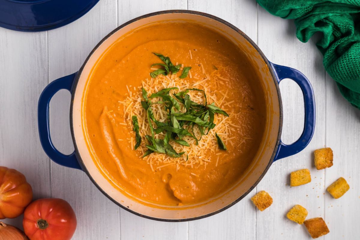 A bowl of tomato soup with croutons and tomatoes from our soup recipes.