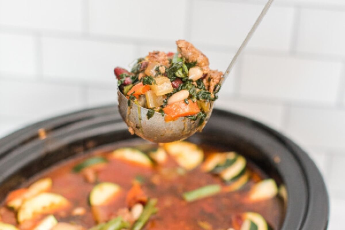 A spoon of soup recipes in a pot.