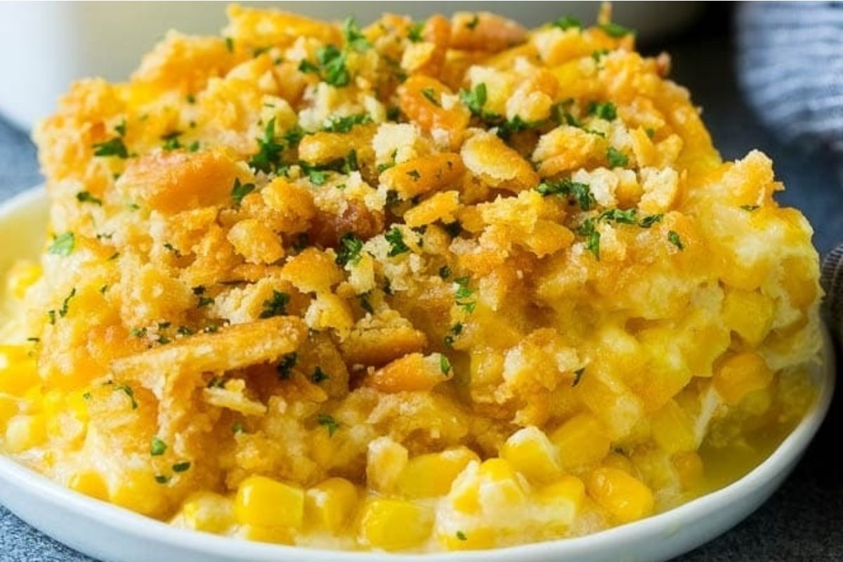 Spring corn casserole in a white bowl.