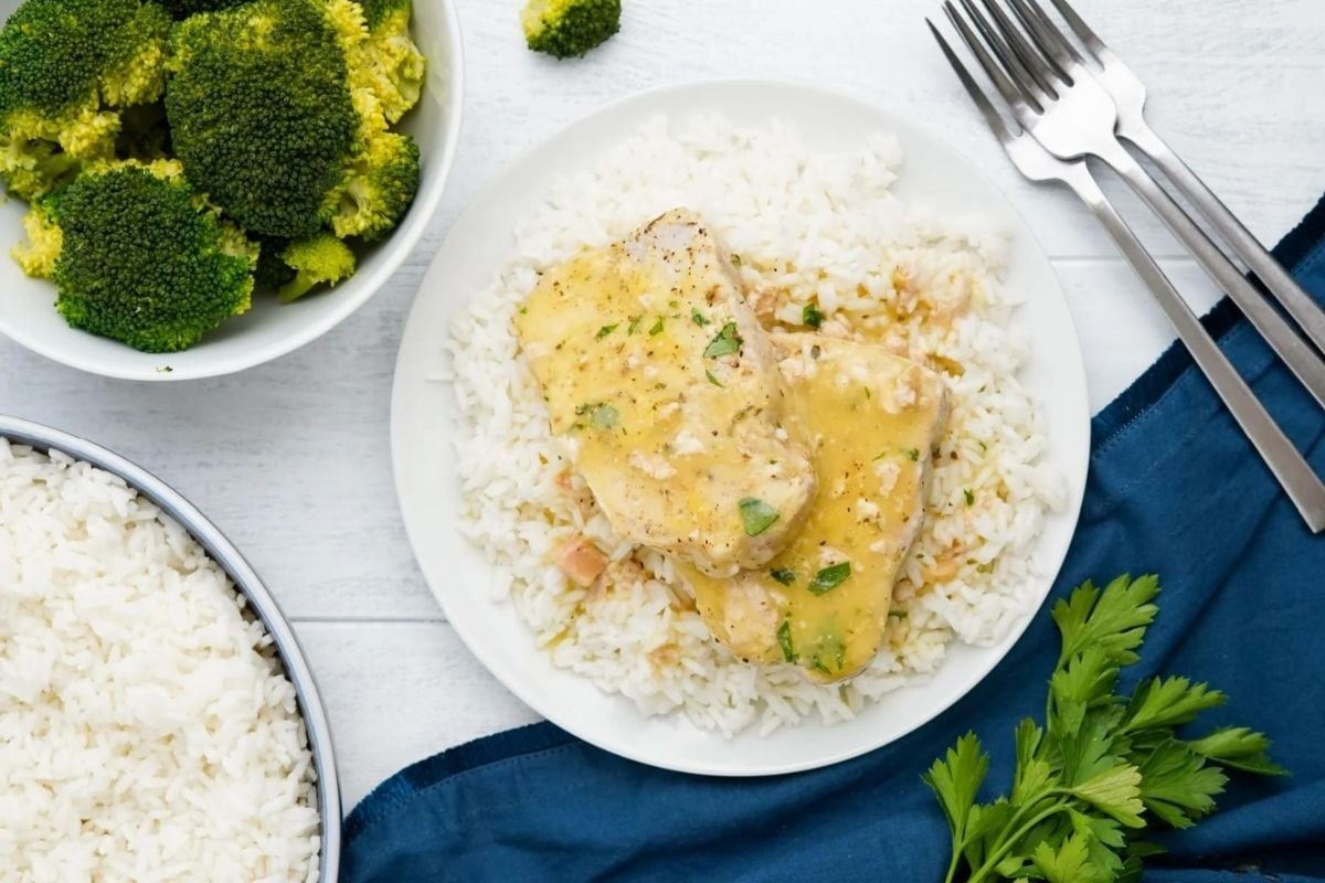 A plate with slow cooker recipes for rice and broccoli on it.