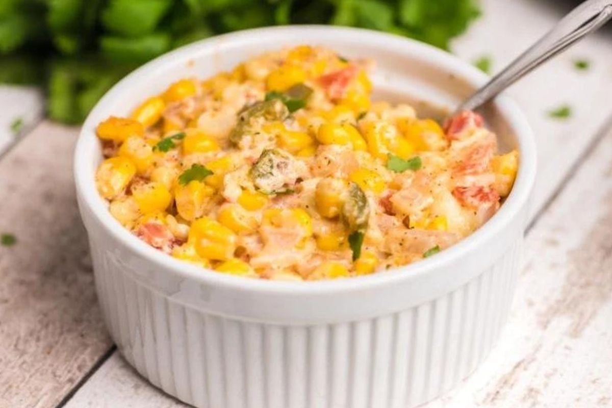 A bowl of corn and cheese from slow cooker recipes.