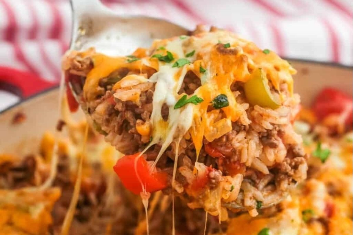 Spring cheesy meat and rice casserole in a skillet.