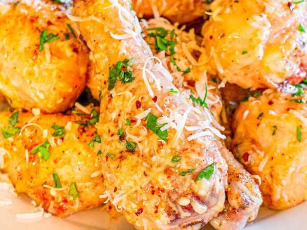 Garlic Parmesan Sheet Pan Chicken Drumsticks a white plate.