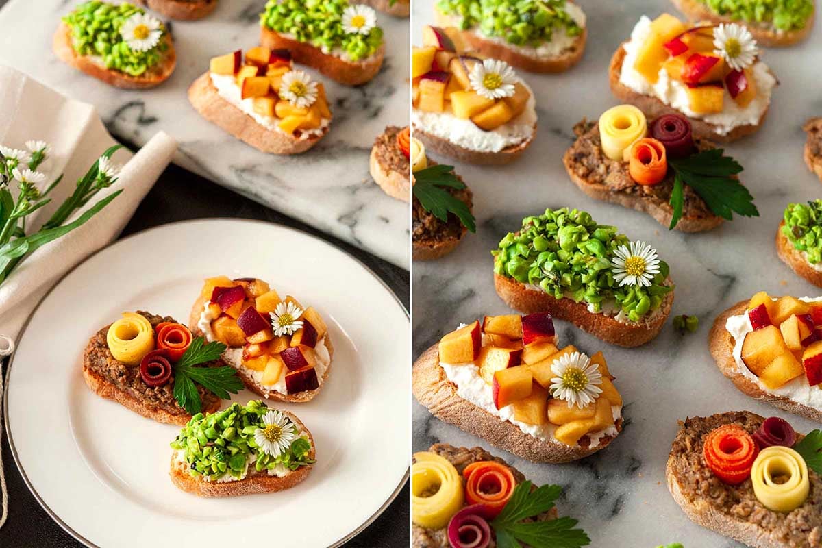 Assorted crostini with various colorful toppings displayed on a marble surface as an Easter appetizer.