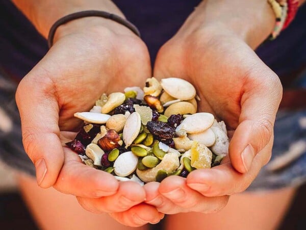 Hands Cupping Homemade Trail Mix.