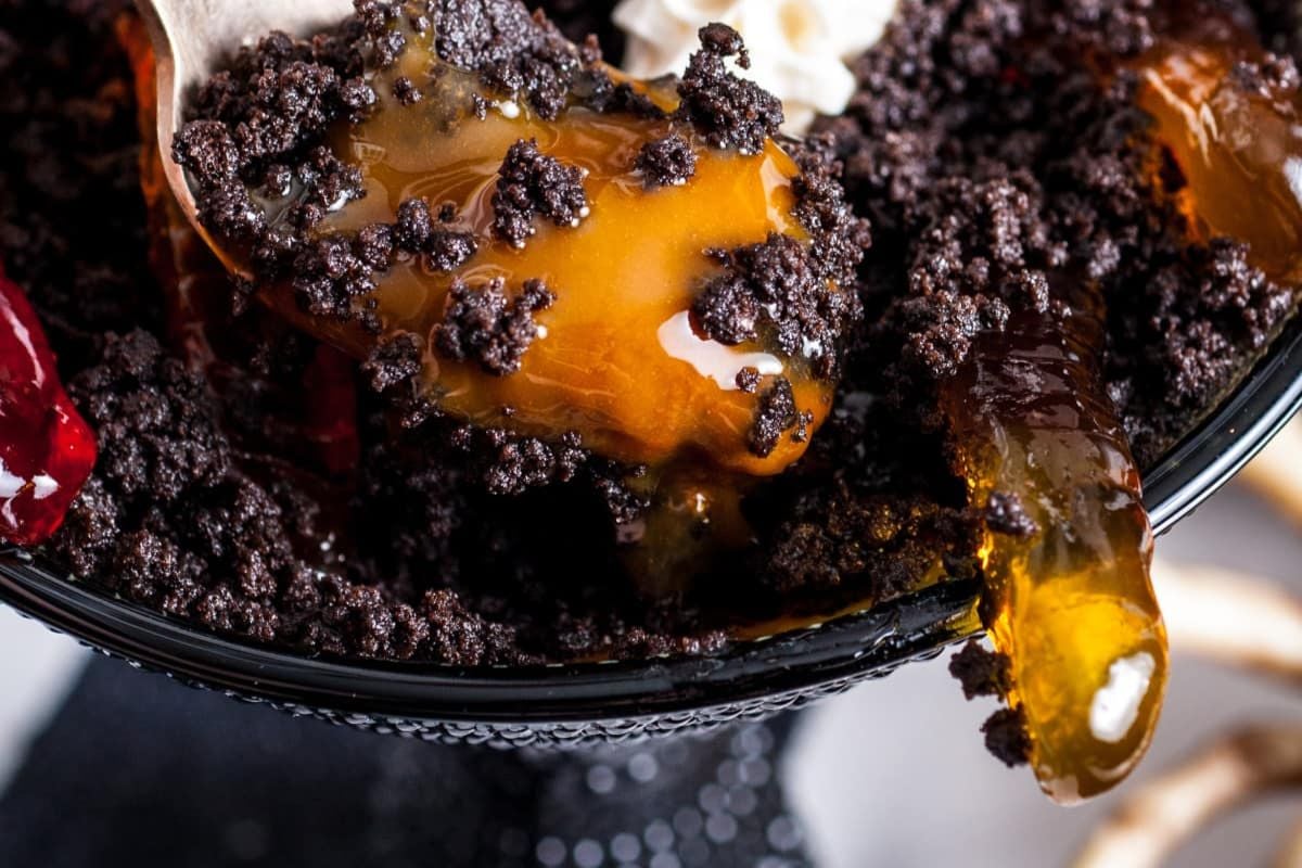 A close-up view of a dessert featuring chocolate crumbs and caramel sauce from our Caramel Recipes collection.