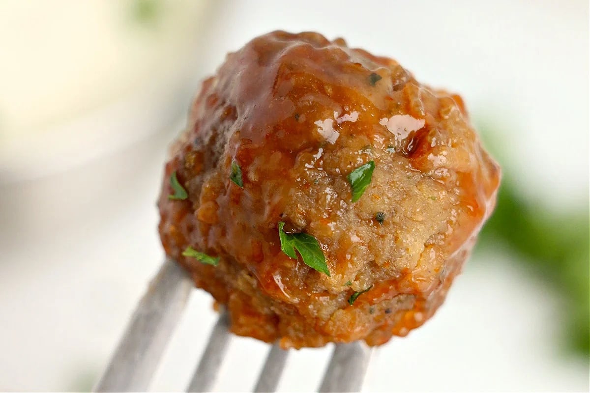 A meatball on a fork.