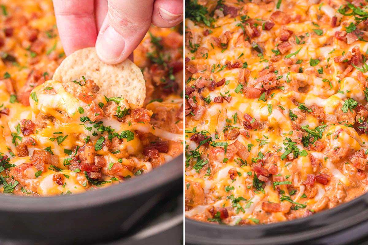 A hand dips a cracker into a cheesy dip topped with bacon, herbs, and ketchup in a black skillet.