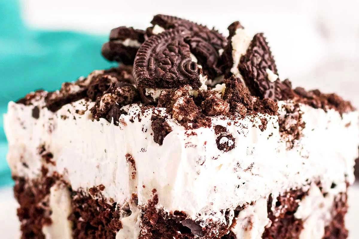A close-up of a creamy pudding mix dessert topped with crumbled chocolate cookies.