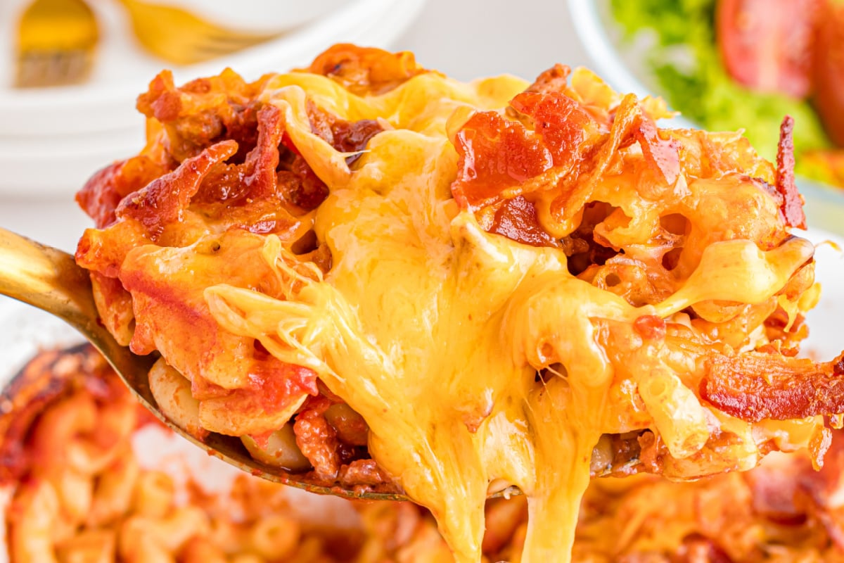A spoonful of Easy Bacon Cheeseburger Pasta held in the air.