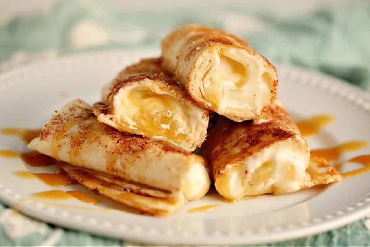 A pile of chimichangas on a plate.