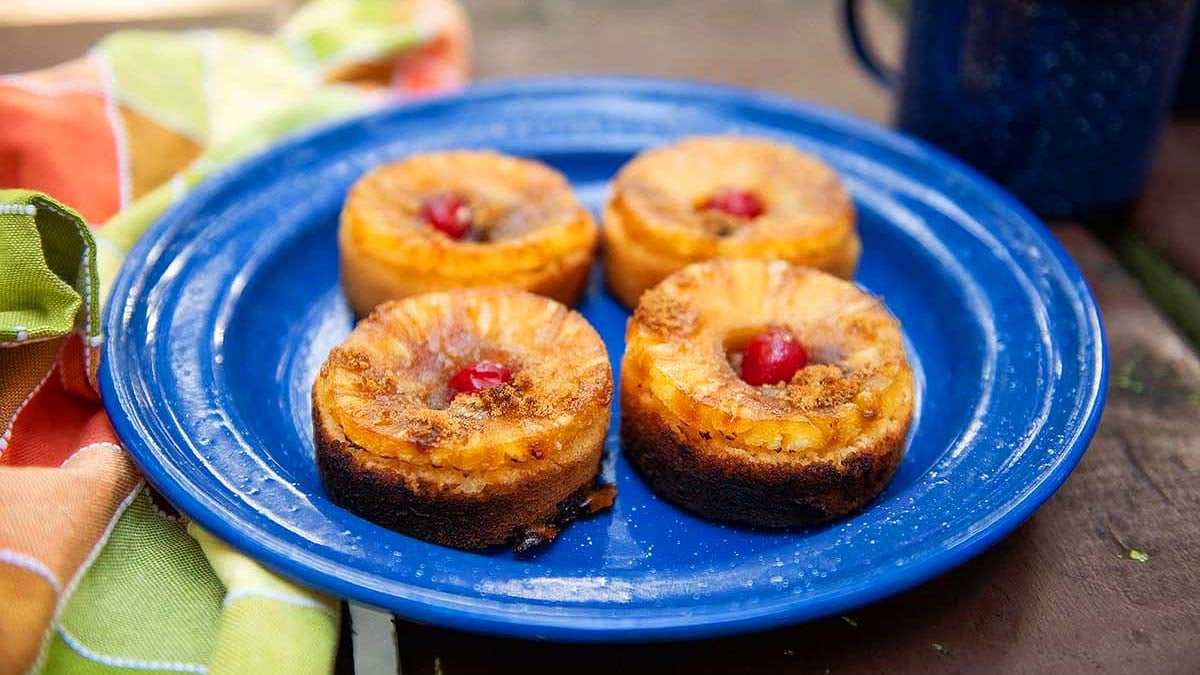 Campfire cakes with caramelized pineapple rings on top.
