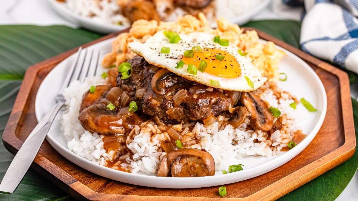 Classic Hawaiian loco moco with a beef patty, rice, gravy, and fried egg.