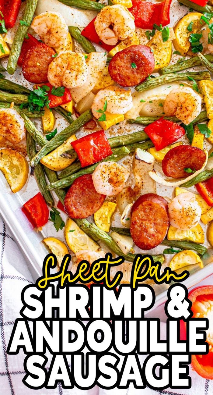 Sheet pan shrimp and andouille sausage are paired with green beans, red bell peppers, and yellow squash for a colorful, flavorful meal.