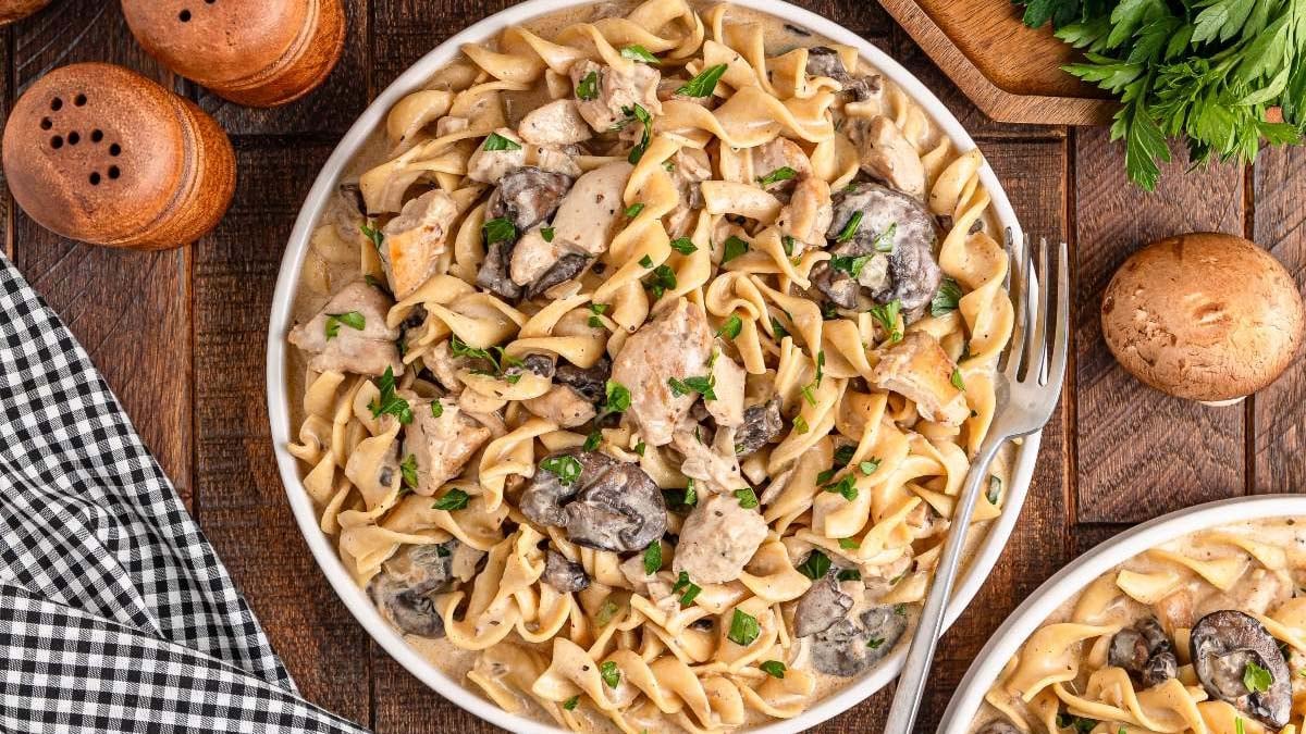 Creamy chicken stroganoff over noodles.