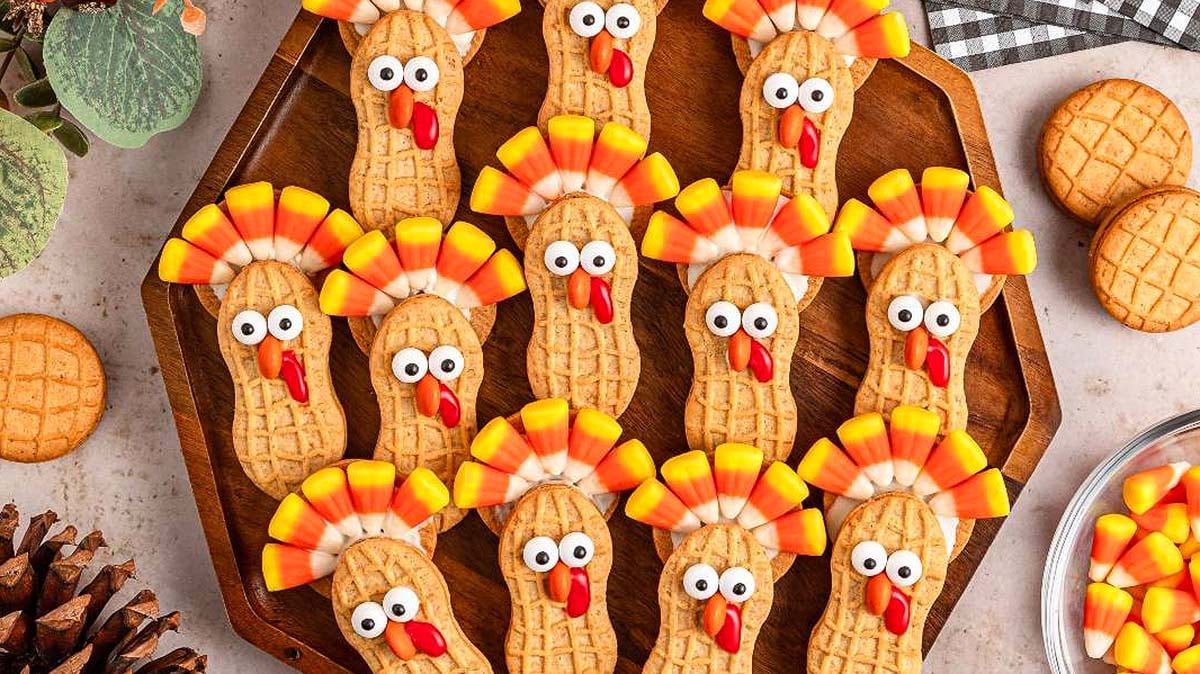 Festive turkey-shaped cookies made from Nutter Butters and candy decorations.