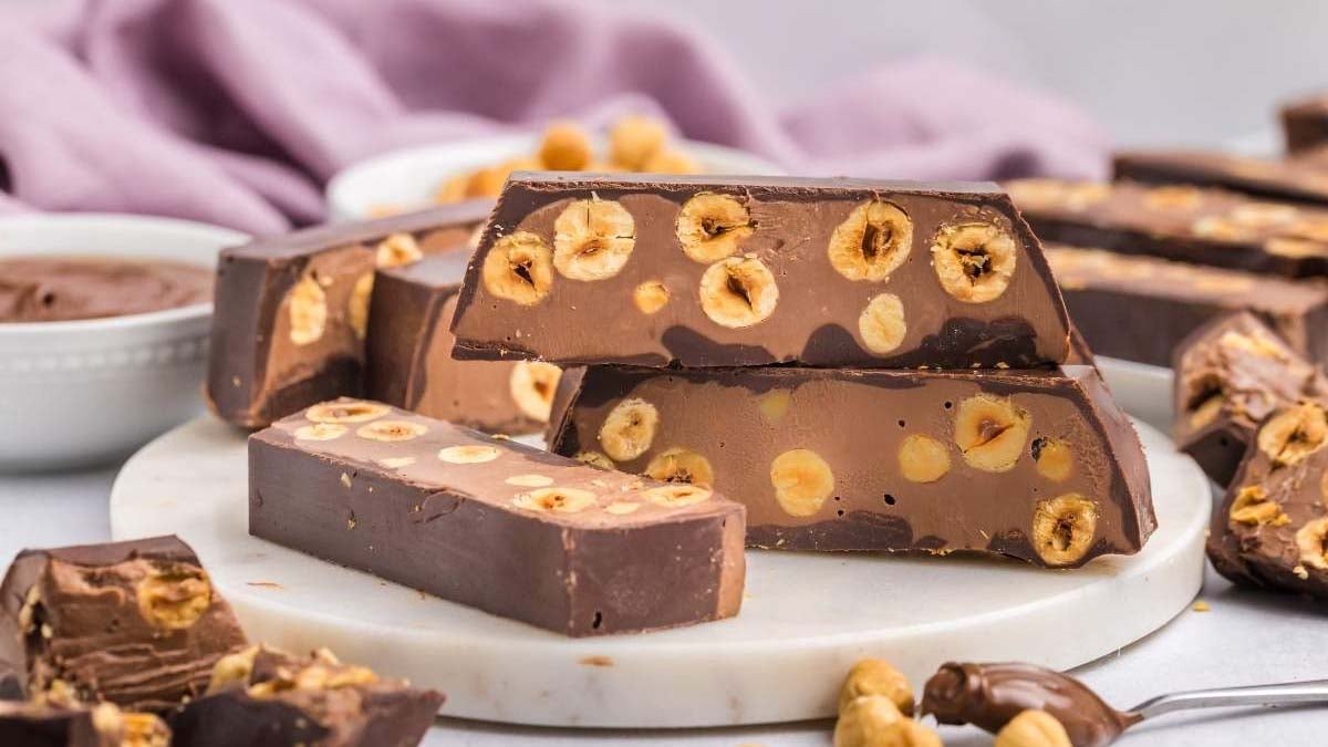 Chocolate hazelnut torrone with a rich, nutty texture and glossy surface.