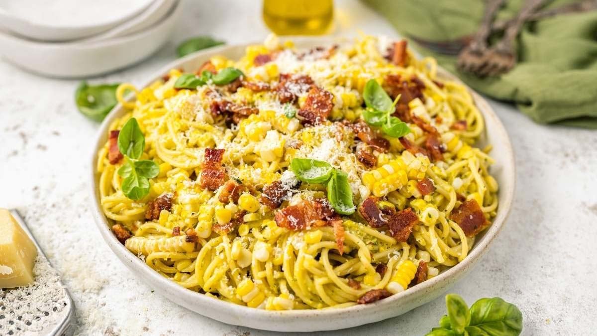 Creamy spaghetti carbonara tossed with sweet corn and crispy bacon bits.