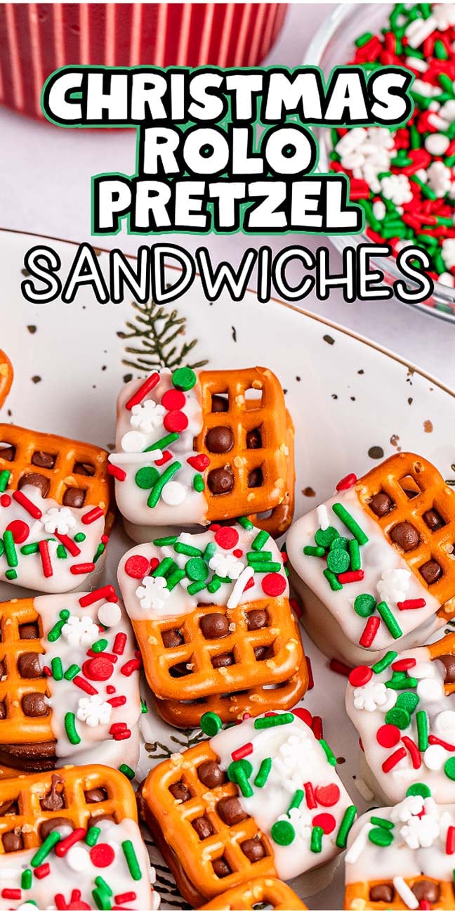 A plate of festive Christmas Rolo pretzel sandwiches, adorned with vibrant red, green, and white sprinkles, sits beside a bowl filled with even more colorful sprinkles.
