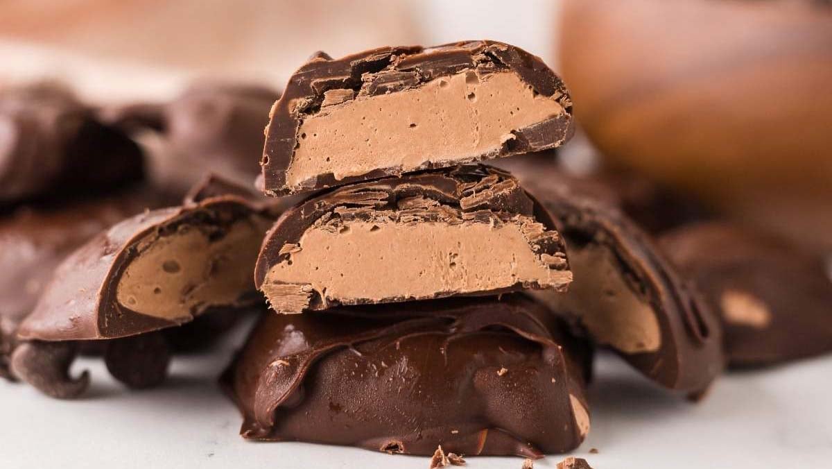 Mini chocolate candies filled with fluffy nougat and coated in chocolate.