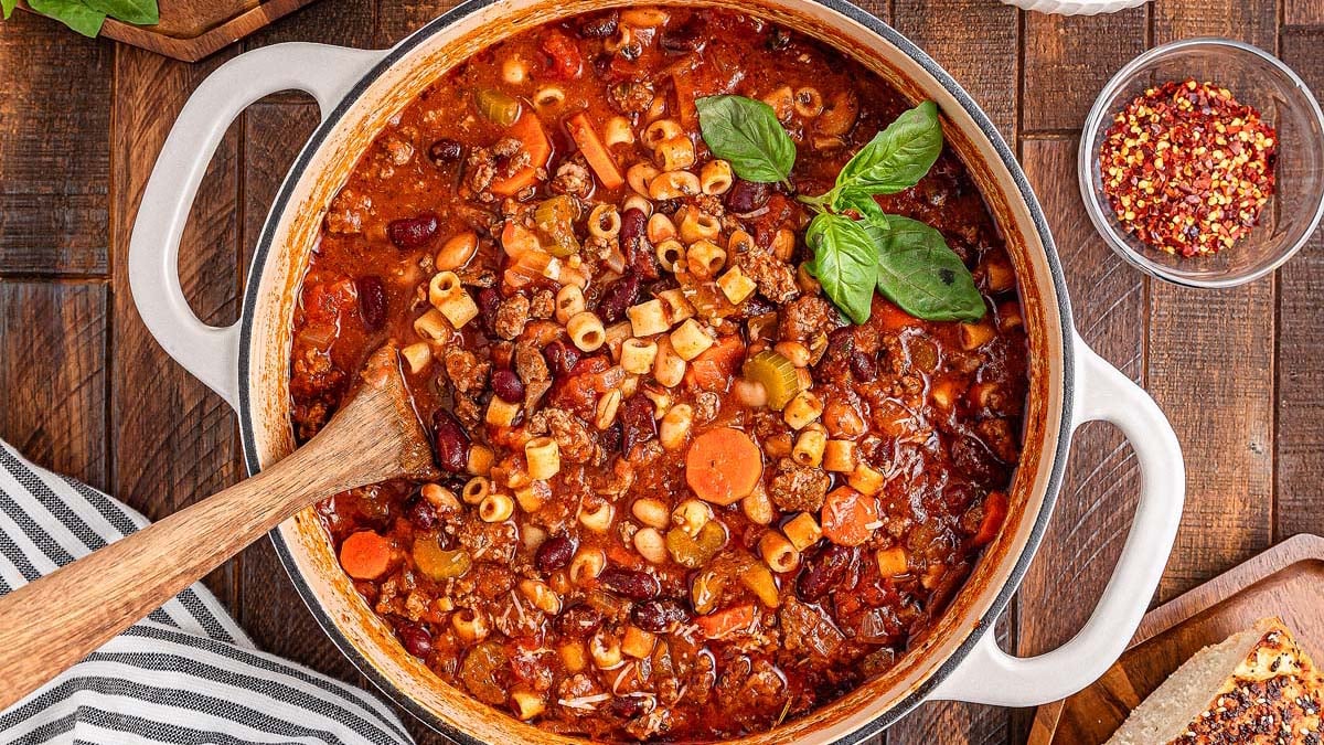 Bowl of hearty pasta e fagioli soup with beans, pasta, and vegetables.
