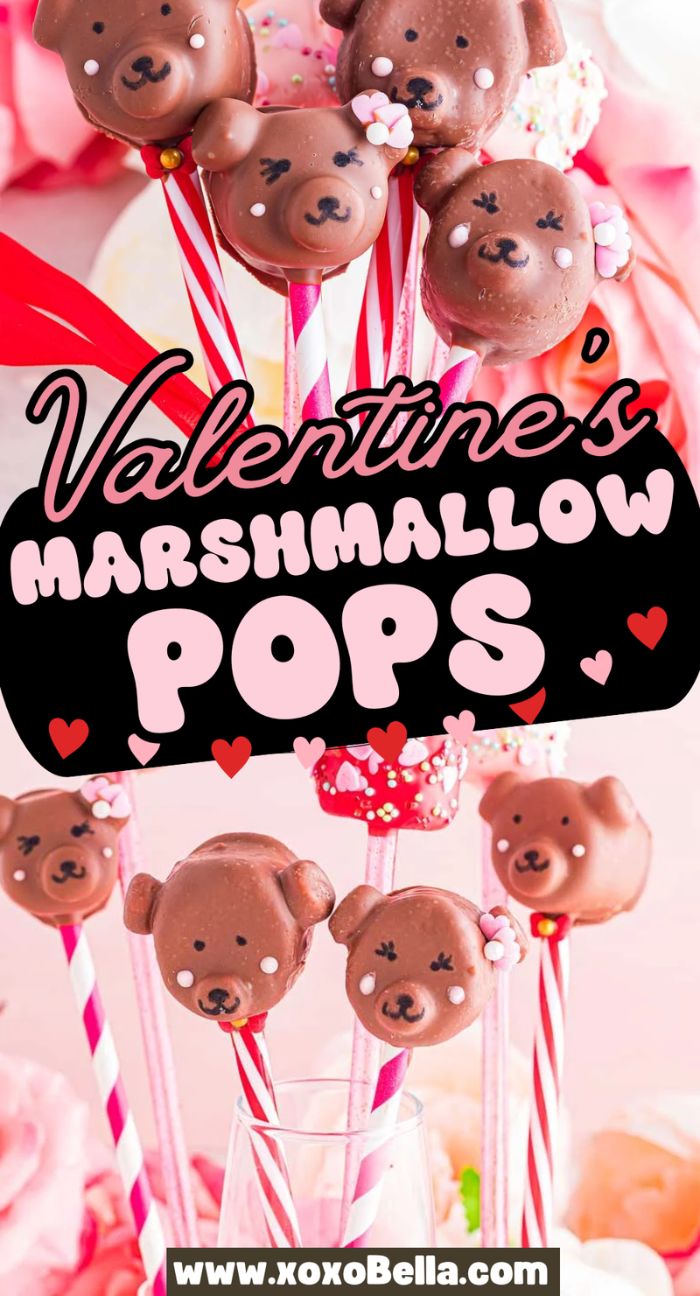Valentine marshmallow pops shaped like cute bear faces sit on colorful sticks, perfectly decorated for Valentine’s Day.