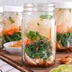 Mason jar Miso Chicken Soup meal prep recipe on a board.