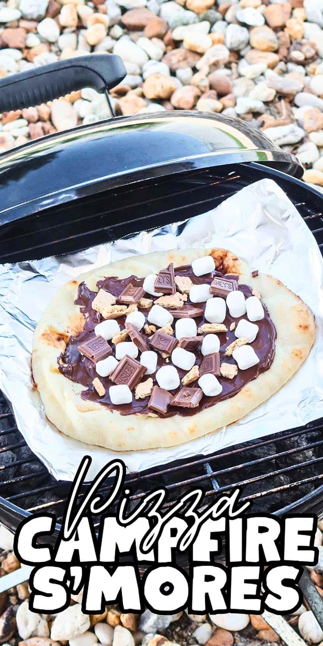 Pizza crust topped with chocolate, marshmallows, and graham crackers on foil over a grill; text reads "Campfire S'mores Pizza.