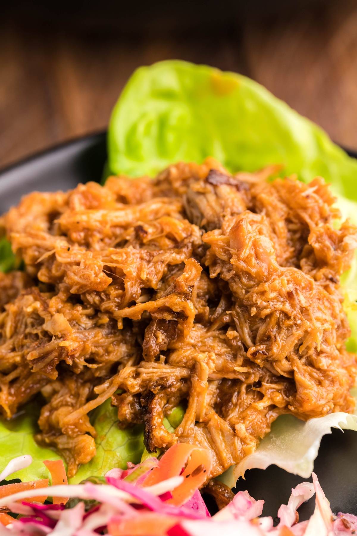 Slow cooked pork shoulder, shredded and served as pulled pork in lettuce wraps, with a side of Dairy Free Vegan Coleslaw.