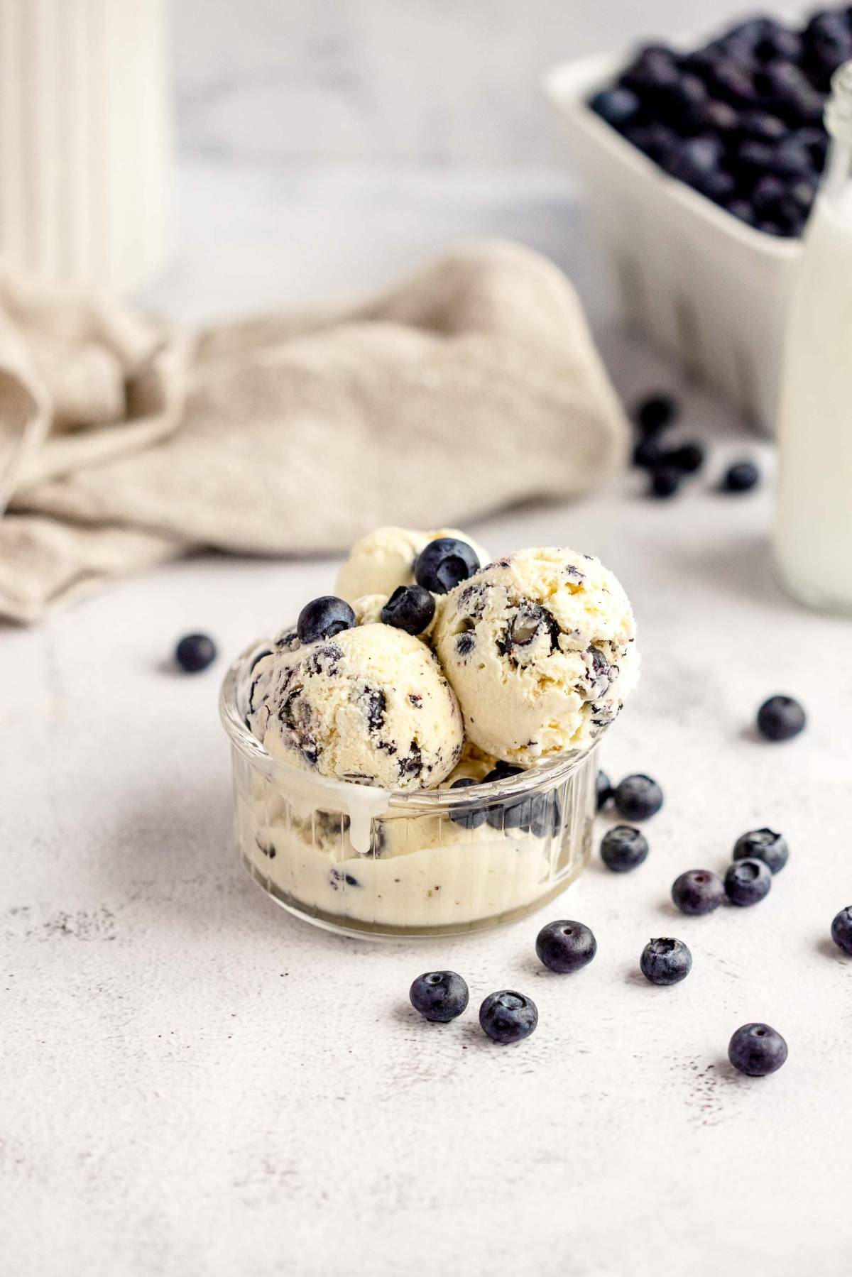 A bowl of Blueberry Cheesecake Ice Cream made with fresh blueberries and cream cheese.