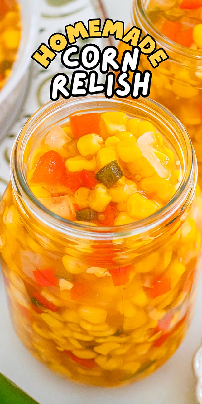 A jar filled with colorful homemade corn relish, packed with corn, red peppers, and onions. Text: Corn Relish.
