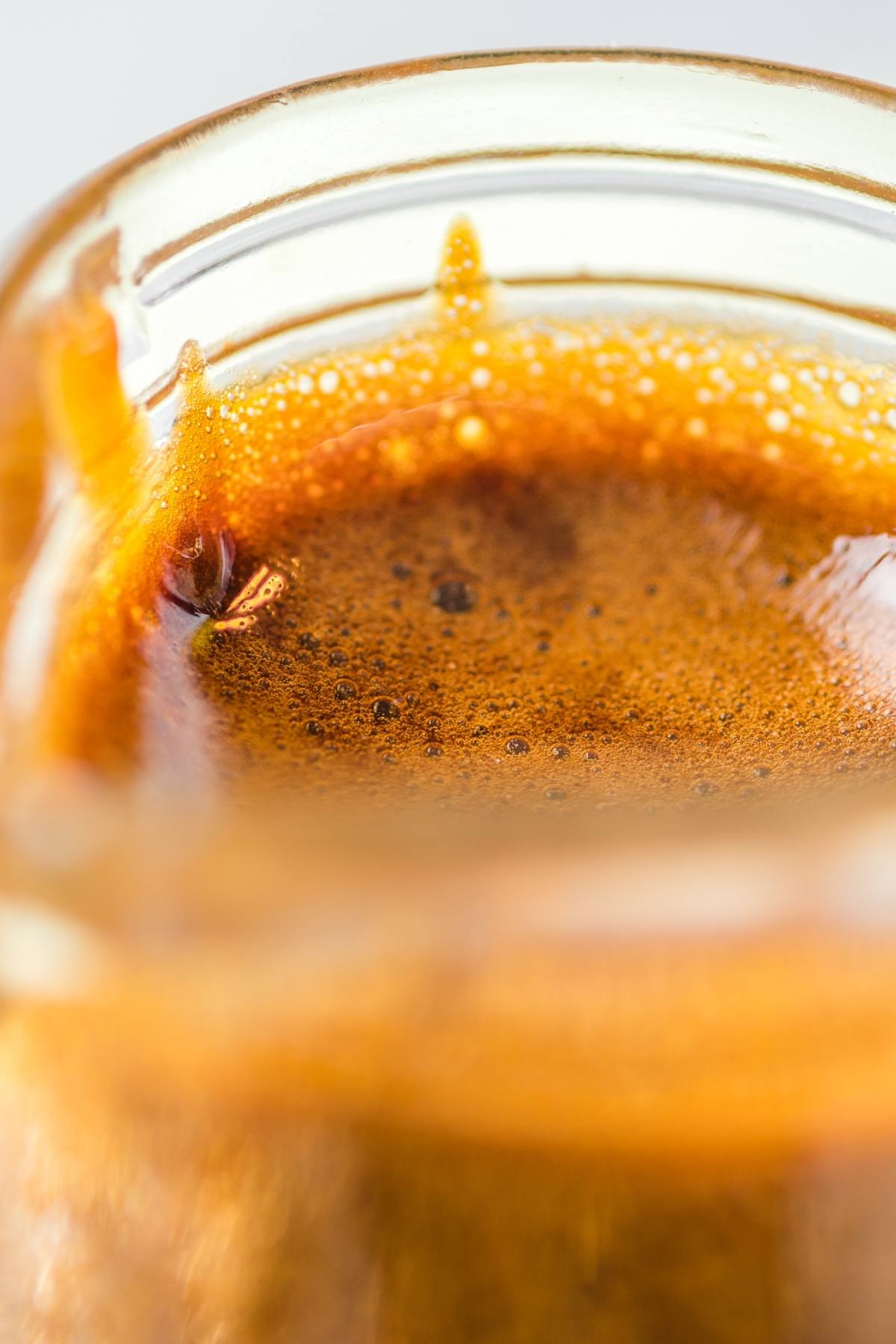 Close-up of rich espresso crema atop a freshly brewed cup of coffee, as inviting as homemade unagi or a drizzle of savory Homemade Eel Sauce (Unagi Sauce) on your favorite dish.