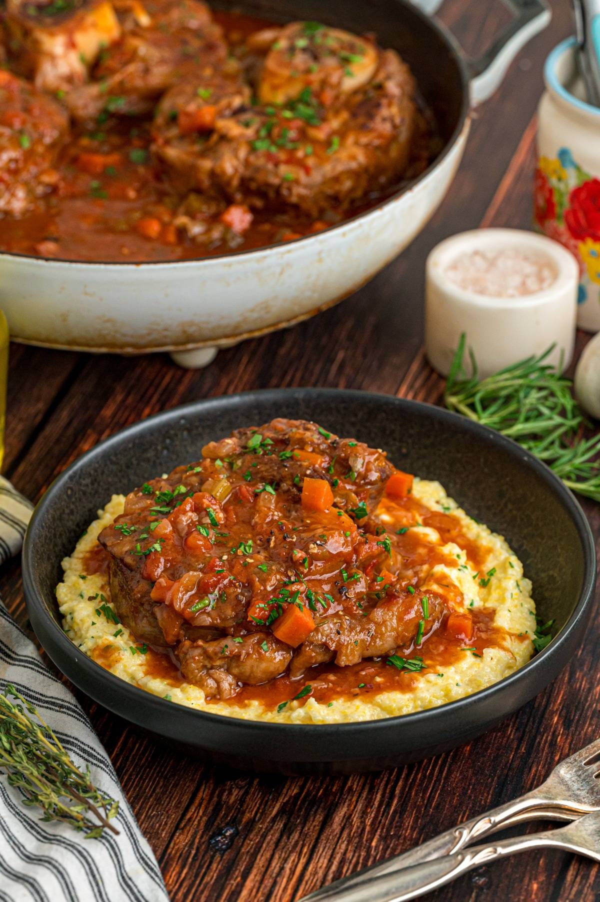 A bowl of Italian osso buco on a table.