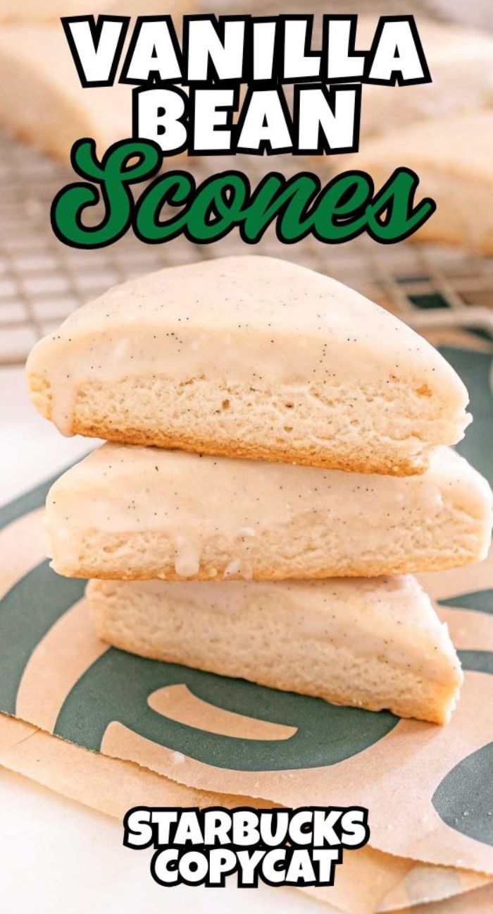 Three Starbucks Copycat Vanilla Bean Scones stacked on a Starbucks napkin, each topped with a luscious vanilla glaze.