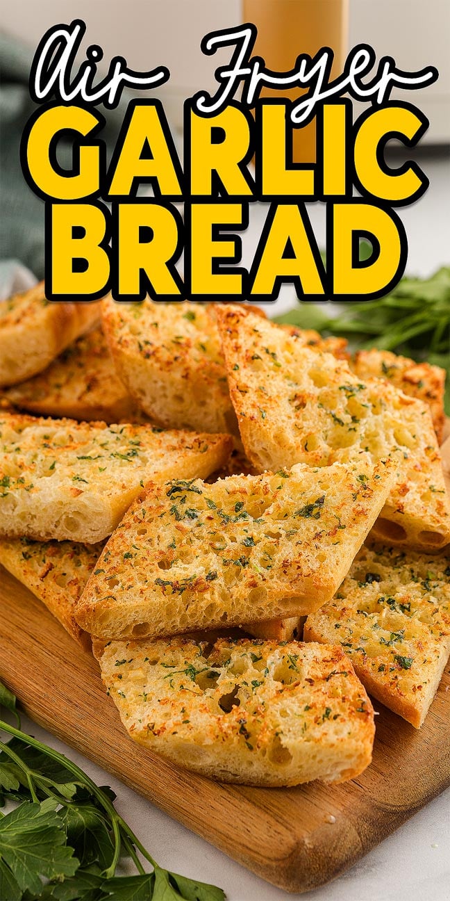 Slices of golden air fryer garlic bread rest on a wooden board, with "Air Fryer Garlic Bread" text displayed above.