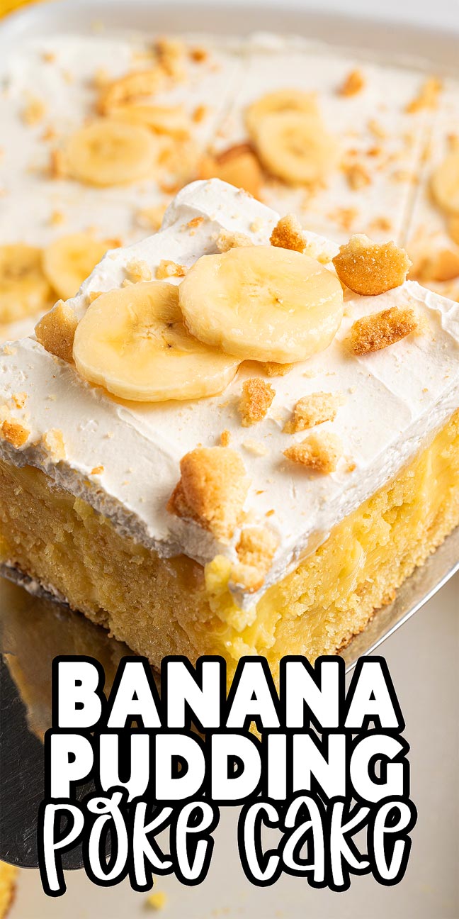 A slice of banana pudding poke cake topped with whipped cream, fresh banana slices, and cookie crumbs.