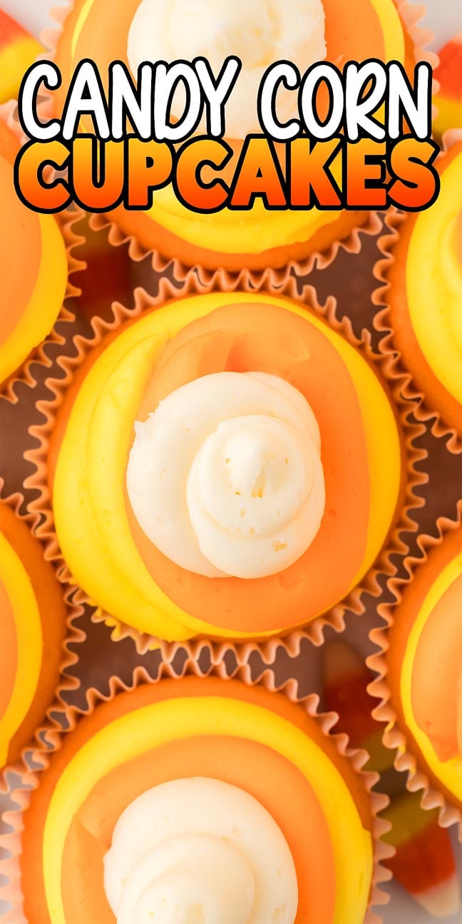 Candy corn cupcakes with orange, yellow, and white frosting are arranged to look like classic candy corn, viewed from above.