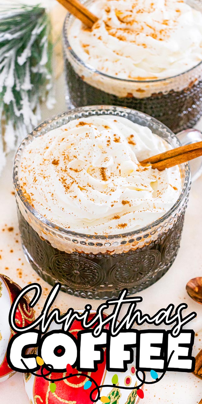 Two mugs of Christmas coffee topped with whipped cream and cinnamon, surrounded by festive decorations, and the text "Christmas Coffee.