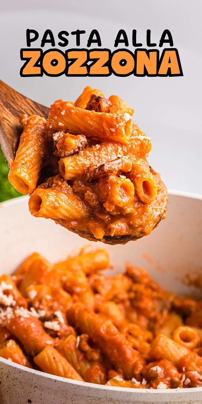A wooden spoon holds rigatoni pasta alla zozzona in rich tomato sauce above a white bowl; text reads "Pasta alla Zozzona.