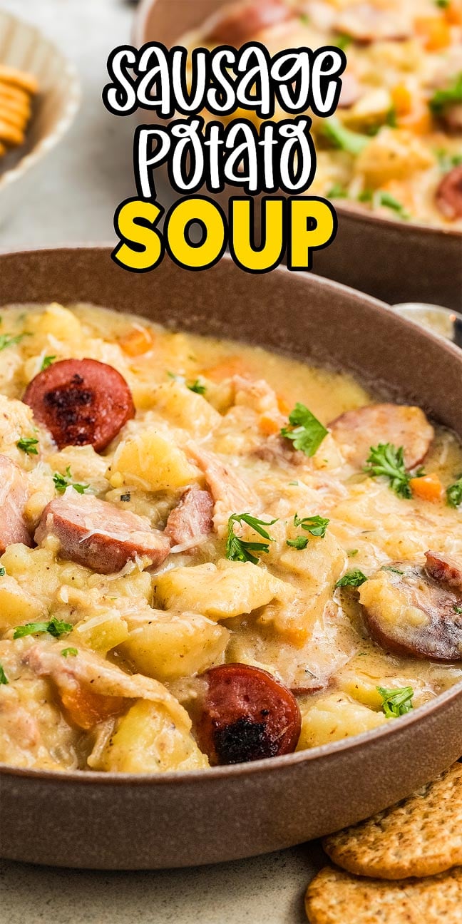 Enjoy a hearty bowl of sausage potato soup, garnished with fresh herbs and served with crisp crackers on the side.