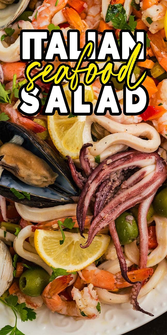 Close-up of Italian Seafood Salad featuring shrimp, squid, mussels, olives, and lemon slices, with text overlay on top.